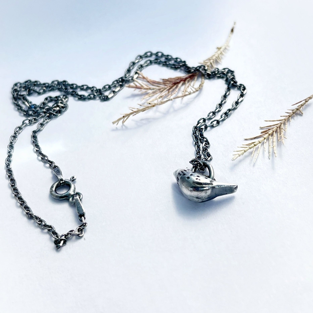 Recycled sterling silver pendant shaped like a bird, crafted in Ireland, shipped across Europe