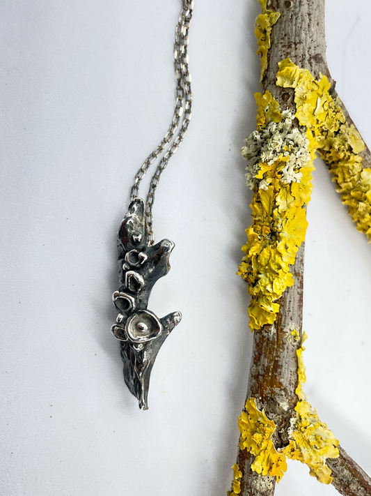 Handmade silver pendant, nature inspired, shaped like a twig covered in lichens. Recycled sterling silver, crafted in Ireland, shipped across Europe