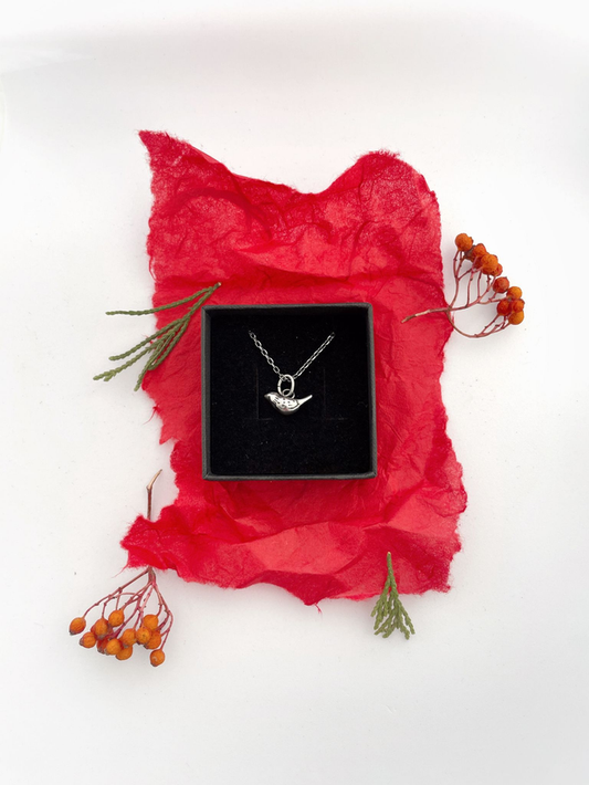 Recycled sterling silver pendant shaped like a bird, crafted in Ireland, shipped across Europe